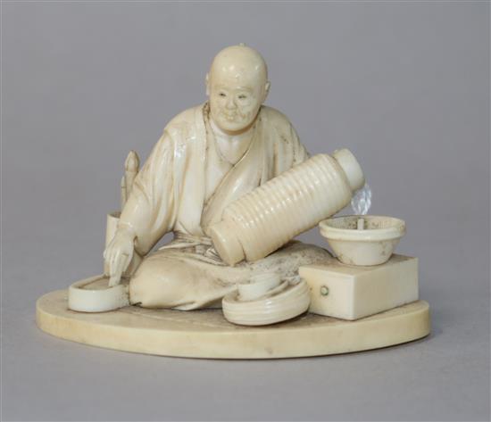 A Japanese ivory figure of a lantern